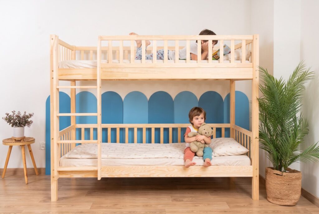 KOSMO Bunk Bed in pine wood in a children's room